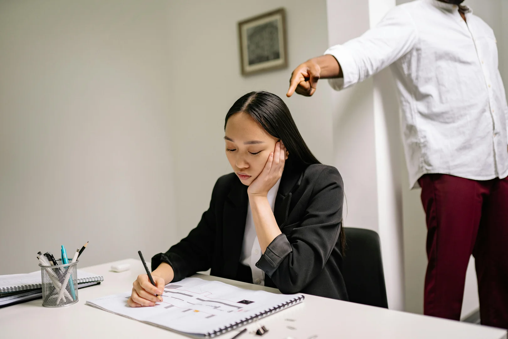 What is the difference between discrimination and harassment in the workplace?