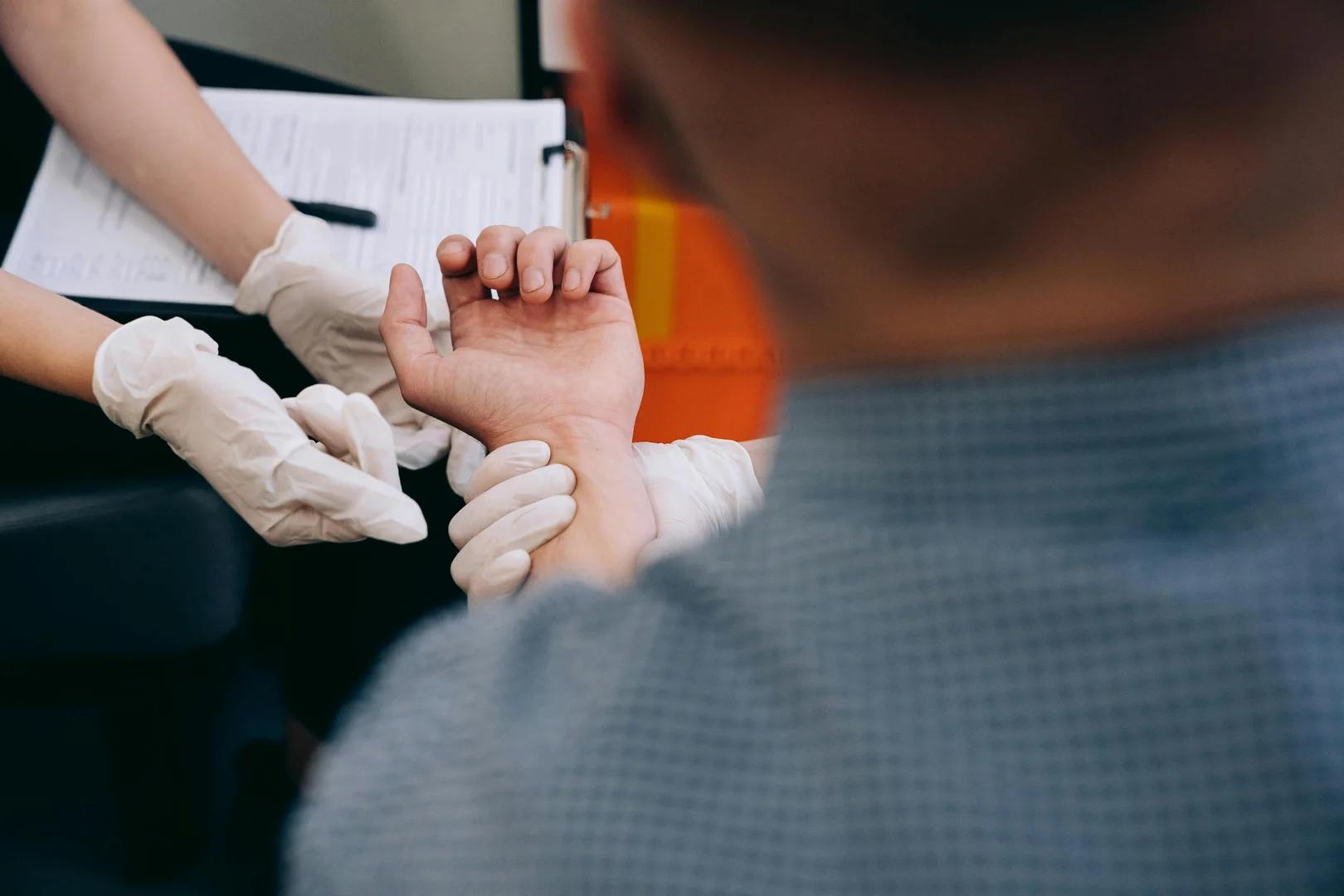 How should I report a work-related injury or occupational disease to the Commissioner for Labour?